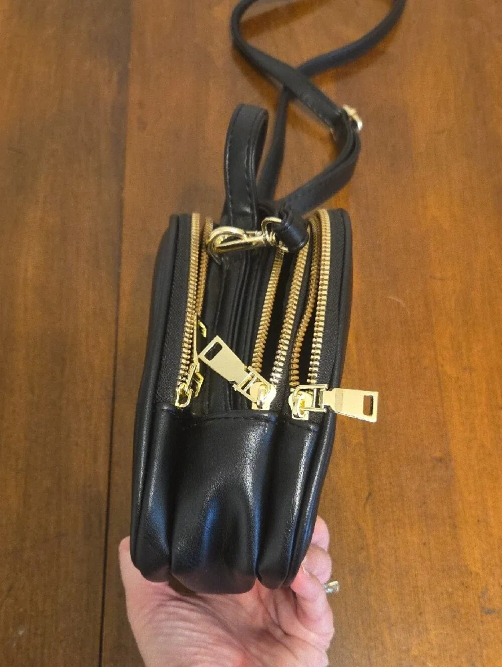 Black Crossbody Bag with Gold Bee Emblem